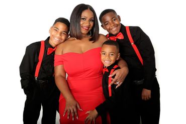 Mom and her 3 boys all dressed up for a Holiday Portrait