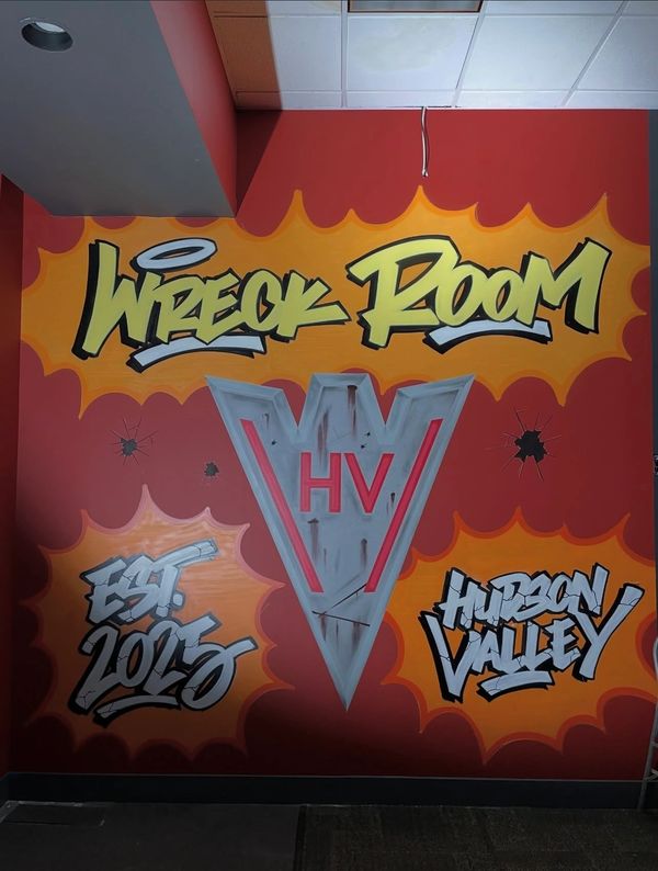 Colorful graffiti on a wall reading 'Wreck Room' with 'Est. 2015' and 'Hudson Valley'.