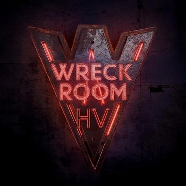 Neon sign reading 'Wreck Room HV' with a dark, grungy background.