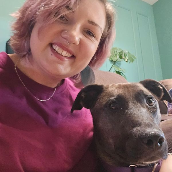 Anissa Jade and her brown dog