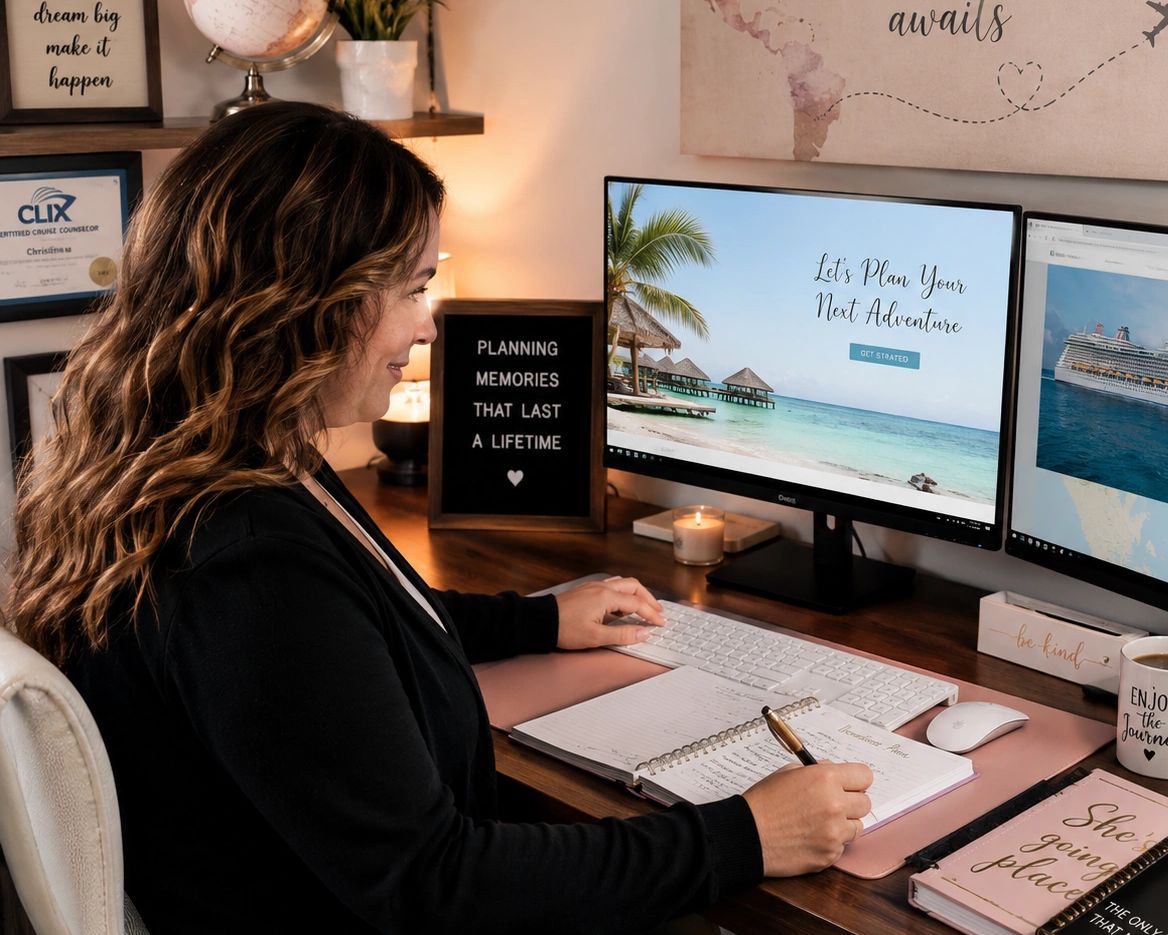 A woman plans a vacation at her desk with dual monitors showing tropical and cruise images.