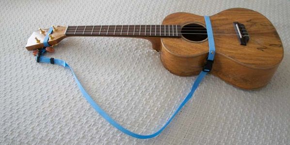 Position the buckle on your back near the shoulder blade, to keep the strap away from your neck.