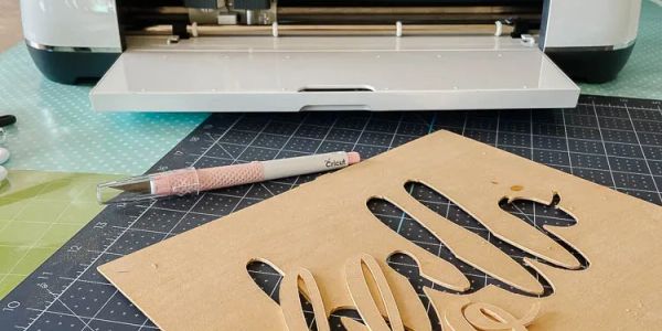 Cricut machine working on a paper craft project.