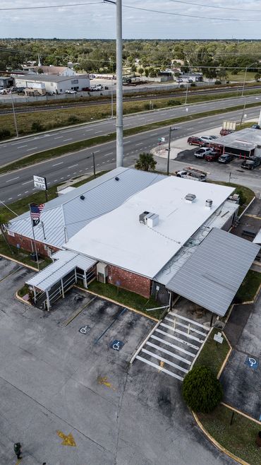 Melbourne florida breviary county Commercial roof. Metal and TPO