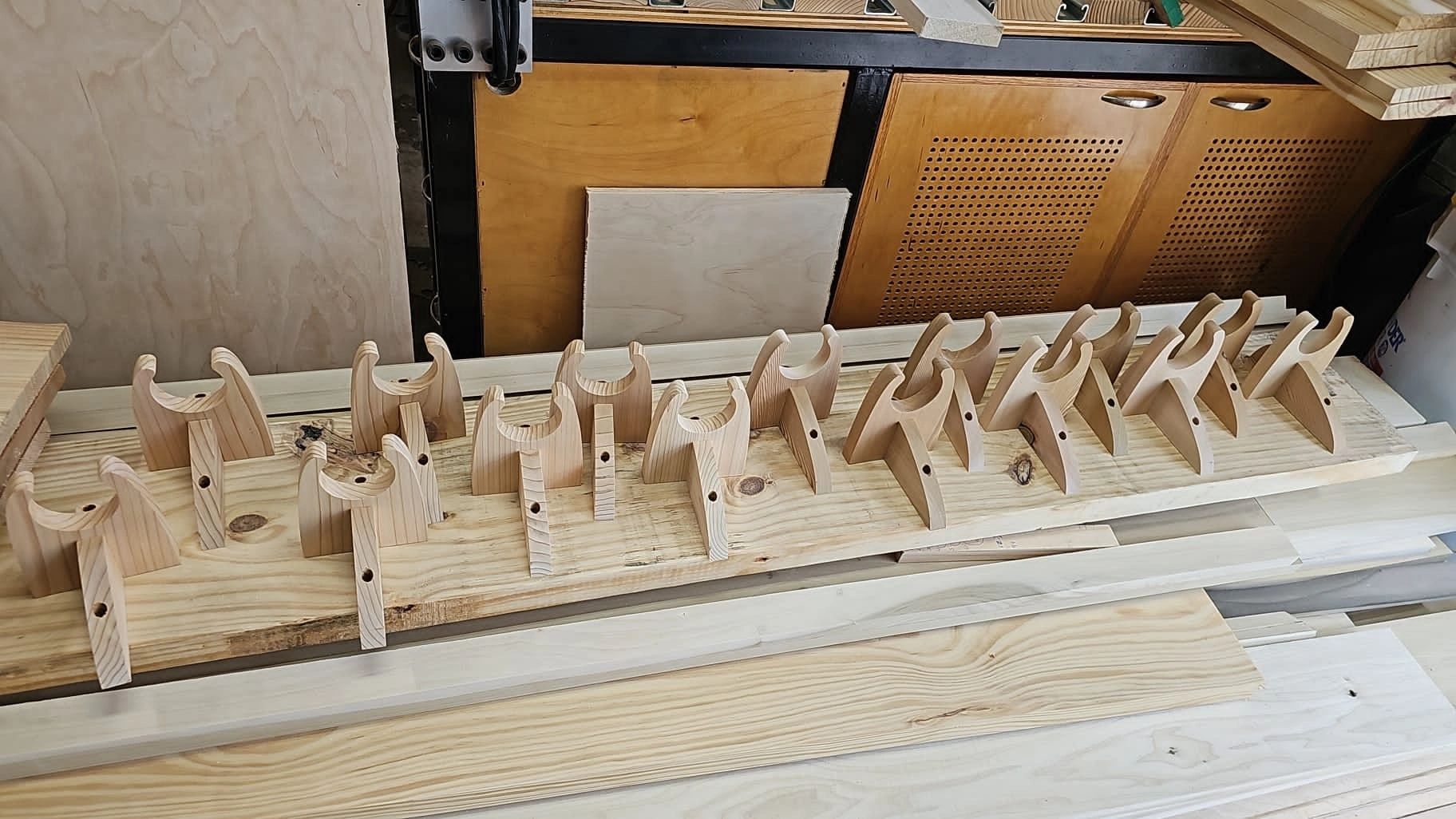 Wooden Guitar Hangers after CNC machine complete cutting, sanding, and assembly is complete.