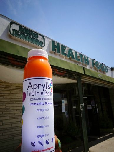 Immunity Booster in front of New Earth Health Food Store. 