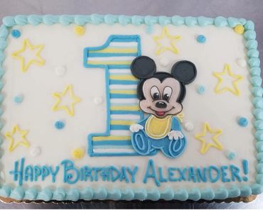 A blue colored first birthday cake for Alexander