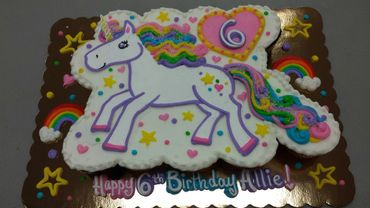 A white color unicorn cake for Allie 6th birthday