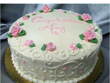 A white colored cake to congratulate Amy