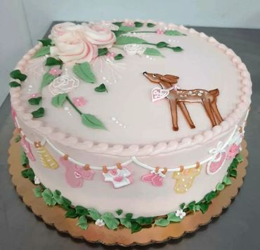 A baby welcoming cake with deer picture on it 