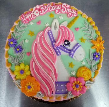A unicorn themed birthday cake for 6th birthday