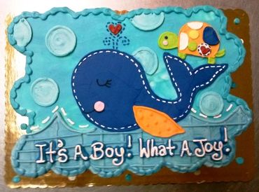 A blue colored cake for gender reveal party