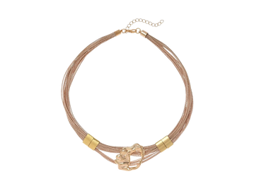 Elegant beige and gold bracelet with a unique abstract centerpiece.