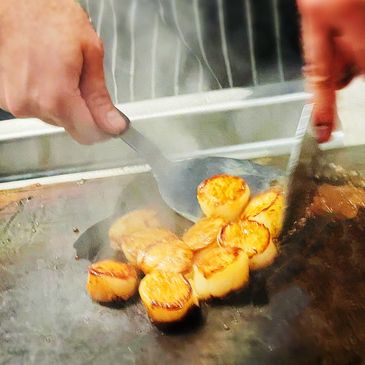 Chef cooking a seafood dish