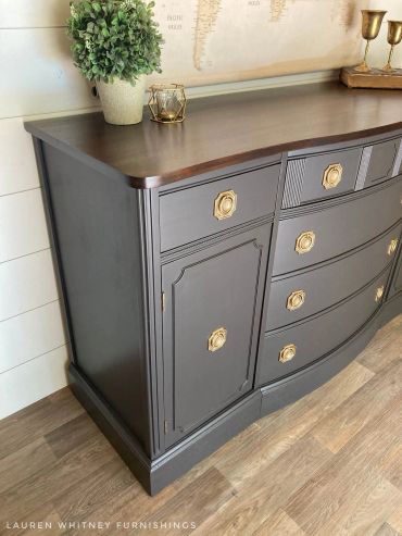 Refinished dark wood dresser with gold handles.