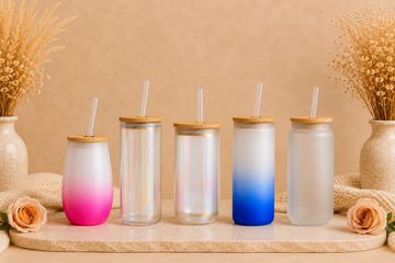 Five stylish tumblers with lids and straws.
