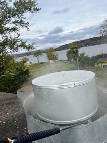 Cleaning of a commercial kitchen exhaust rooftop exhaust fan