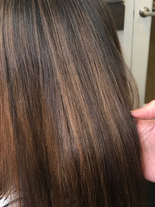 natural golden highlights on long brown hair