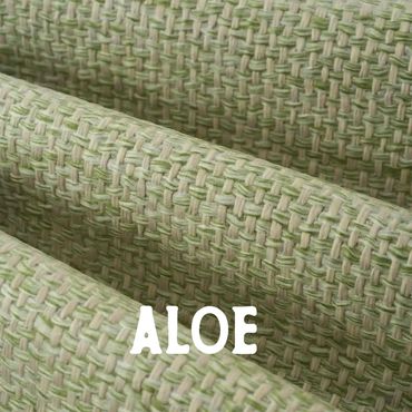 Close-up of green and beige woven fabric labeled Aloe.