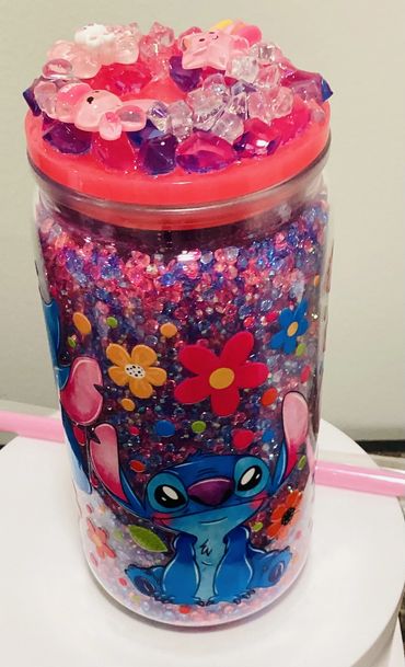 This stunning pink and blue rhinestone tumbler i pure sparkle and style, The fake ice lid adds a pla