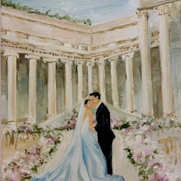A bride and groom share a kiss in a grand, floral-decorated setting.