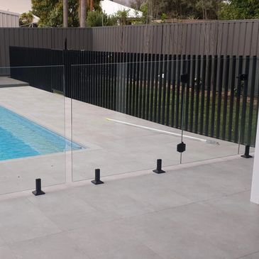 matte black glass pool fence, glass pool fence,  pool fence, spigots, glass, backyard, garden, lands