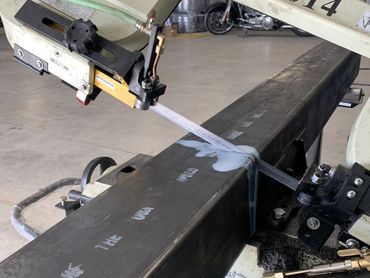 Steel being cut for table legs.