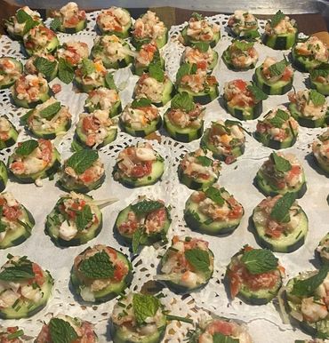 Catered 150 person birthday in Guerneville, CA.  Tapas themed.  Cucumber canapes with seafood.