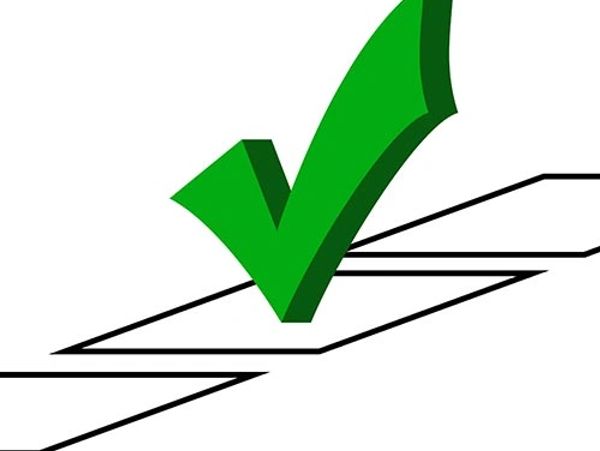 Green check mark over a checkbox symbolizing approval or correctness.