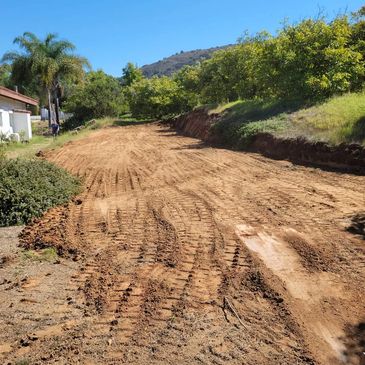 Grading a rough RV pad in the hill side. Slope is overcut so customer can add retaining wall