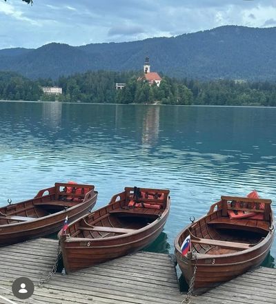 Lake Bled island with traditional wooden boats – transfer from Trieste Airport to Lake Bled