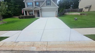 Driveway and sidewalk pressure washed