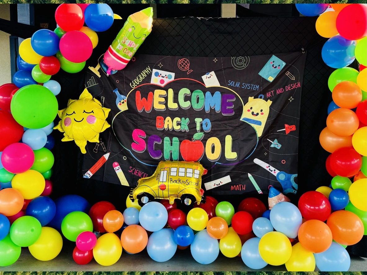 Colorful welcome back to school party balloons and banner.