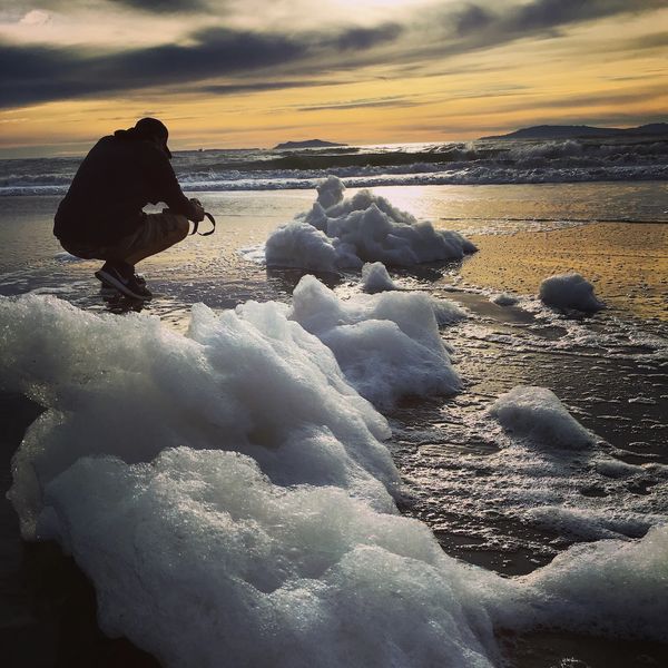 Dave Castro Photography photographing sea foam on a beach