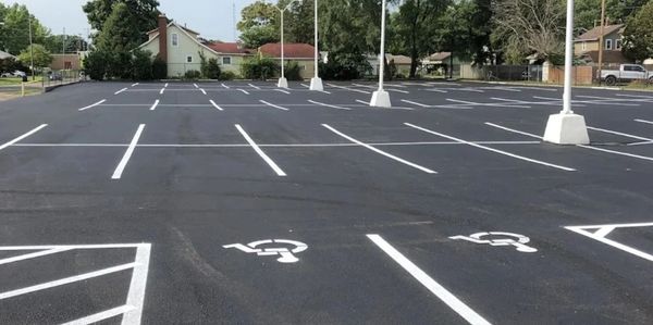 Empty parking lot with handicap spaces marked.