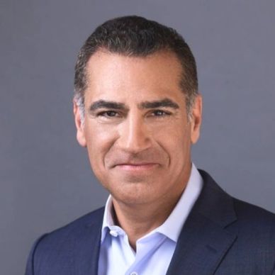 Professional man in suit smiling.