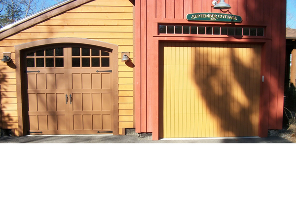 Wood Carriage House and T-11 overlayed garage doors