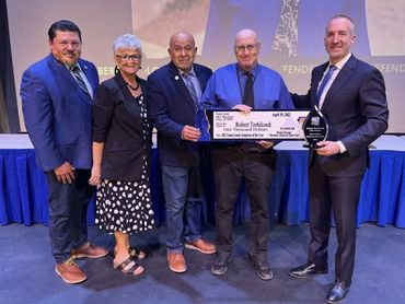 Ian McGaughey presenting the Employee of the Year award