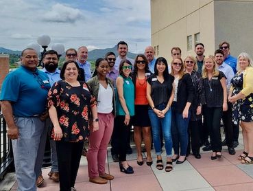 Ian McGaughey posing with Project CENTRL classmates