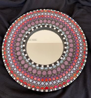 This mosaic mirror would be a great addition to an entryway, bedroom, living room, etc...