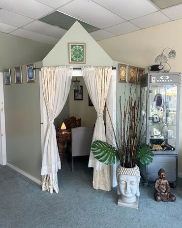 A private area for readings, Buddha statues sit outside of the room.