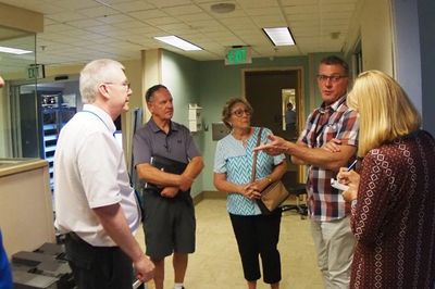A group of people talking in the hospital