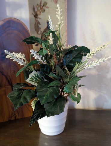 White Ceramic Container with Foliage and Cream Milo