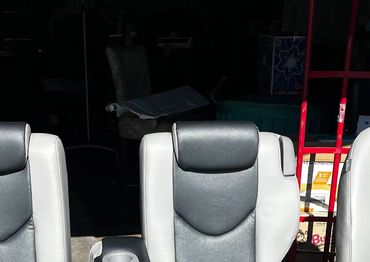 Three gray and black car seats.