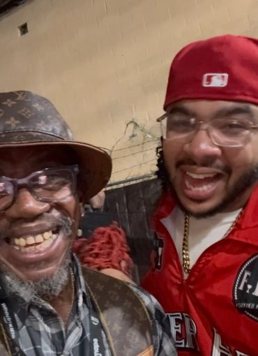 Two men smiling for a close-up photo.