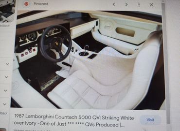Interior of a 1987 Lamborghini Countach 5000 QV in white and ivory.
