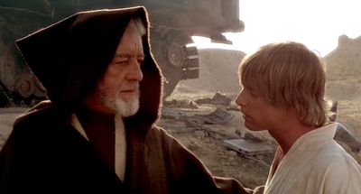 Two characters in a desert setting engaged in a serious conversation.