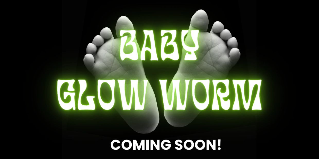 Baby feet with glowing green text "Baby Glow Worm" and "Coming Soon!" against a black background.