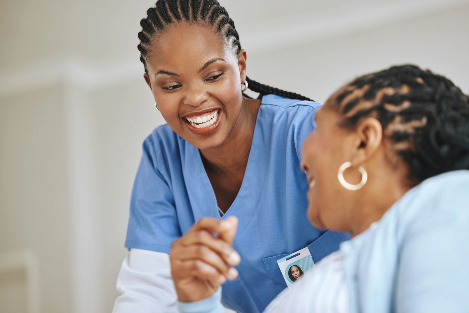 Caregiver providing friendly in-home support to a senior