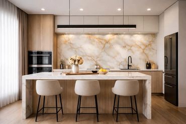 Modern kitchen with marble island, beige chairs, and elegant lighting.